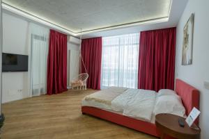 Ένα ή περισσότερα κρεβάτια σε δωμάτιο στο Novum Aparthotel