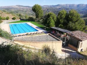 an external view of a swimming pool in a villa at Cal Batistet Ferrer in Torroja