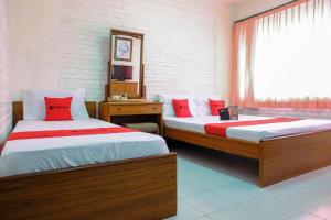 Voodi või voodid majutusasutuse RedDoorz Syariah near Kopeng Treetop Adventure toas