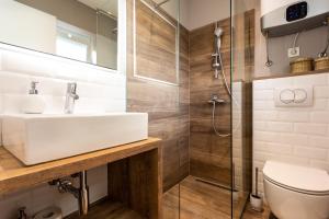 a bathroom with a sink and a shower at Apartments Marija in Baška +110 photos