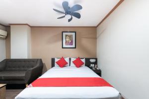 Postel nebo postele na pokoji v ubytování DG Grami Hotel