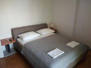 Postel nebo postele na pokoji v ubytování Apartments Božito