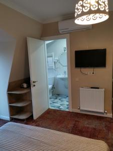 TV a/nebo společenská místnost v ubytování Boutique Hotel BelleVue