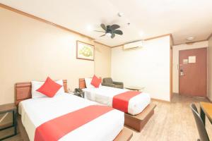 Postel nebo postele na pokoji v ubytování DG Grami Hotel