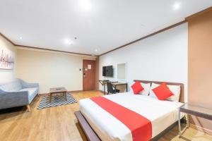 Postel nebo postele na pokoji v ubytování DG Grami Hotel