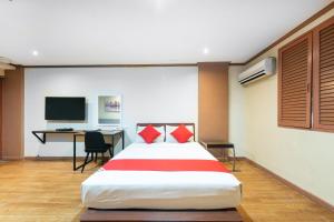 Postel nebo postele na pokoji v ubytování DG Grami Hotel