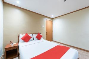 Postel nebo postele na pokoji v ubytování DG Grami Hotel