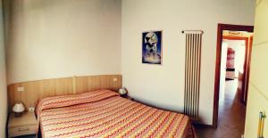 A bed or beds in a room at Residenza Cristina Még 17 kép