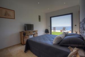 TV a/nebo společenská místnost v ubytování Villa A Luna