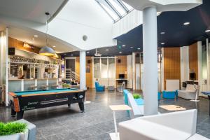 a pool table in the lobby of a building at Auberge de Jeunesse de Mons in Mons