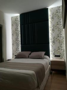 A bed or beds in a room at Aljibe Casa Rural