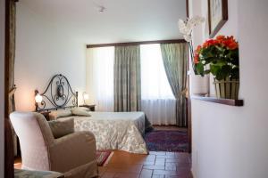 Posteľ alebo postele v izbe v ubytovaní Dimora Palazzo La Fenice