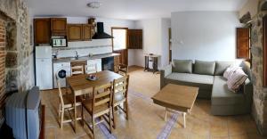 a living room with a couch and a table at Playa La Franca apartamentos in La Franca