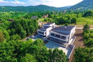 an aerial view of a house in the mountains at B&B Plitvice Area Natura in Seliste Dreznicko