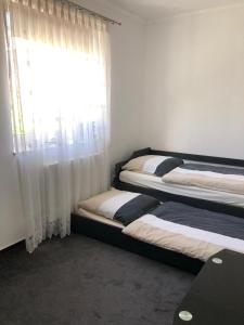 Кровать или кровати в номере Ferienhaus Bäk-Ratzeburg