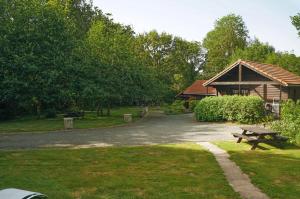 a park with a pavilion and a picnic table at La Coterie Lodges in Blaudeix