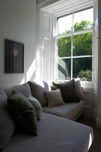 a living room with a couch and a window at 21212 in Edinburgh