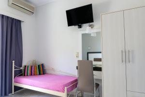 A bed or beds in a room at Studios Magda