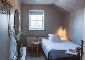Postel nebo postele na pokoji v ubytování Hotell Käringön