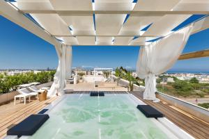 a swimming pool on the roof of a house at Acquaviva Suite in Marittima
