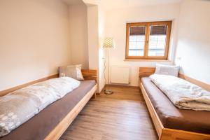 Łóżko lub łóżka w pokoju w obiekcie Apartments Wimpissinger