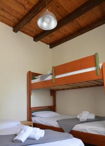 Posteľ alebo postele v izbe v ubytovaní Filoxenos Estia-Houses