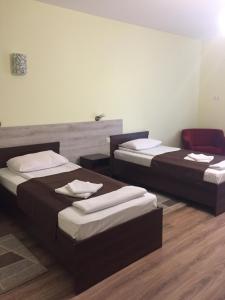 Postel nebo postele na pokoji v ubytování Hotel Karpaty