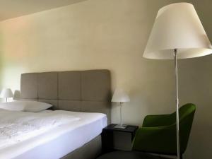 Voodi või voodid majutusasutuse Hotel Krone Lenk toas