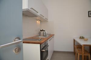 a small kitchen with a sink and a counter at Le Clos des Salins in Toulouse