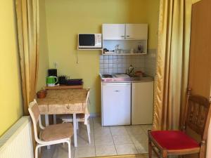 Kuchyňa alebo kuchynka v ubytovaní Green Park Apartment