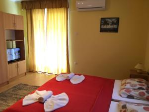 Posteľ alebo postele v izbe v ubytovaní Green Park Apartment