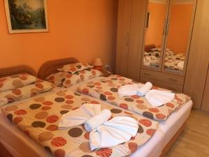 Posteľ alebo postele v izbe v ubytovaní Green Park Apartment