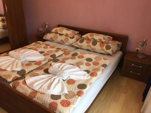 Posteľ alebo postele v izbe v ubytovaní Green Park Apartment