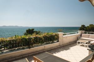 a balcony with a view of the ocean at Apartments Lucija in Zadar
