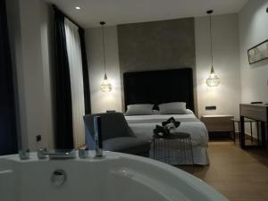 A bed or beds in a room at Aljibe Casa Rural