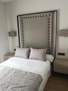 A bed or beds in a room at Aljibe Casa Rural