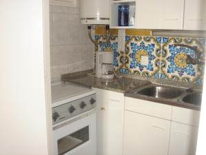 a kitchen with a sink and a counter top at Alexandra B-4 in Platja d'Aro