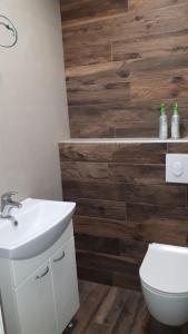 a bathroom with a white sink and a toilet at Best4You Apartment - sea view - 70 m2 - 2 bedrooms in Dubrovnik +31 photos