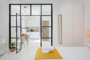 Postel nebo postele na pokoji v ubytování Twins Idola Apartments