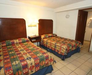 Cama o camas de una habitación en Hotel Calenda
