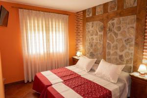 Posteľ alebo postele v izbe v ubytovaní El Mirador de la Atalaya