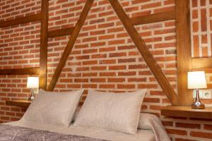 Posteľ alebo postele v izbe v ubytovaní El Mirador de la Atalaya