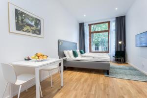 Postel nebo postele na pokoji v ubytování ApartDirect Sundbyberg