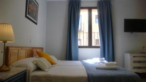 Posteľ alebo postele v izbe v ubytovaní Casa Armas A, en Zocodover, Casco Histórico