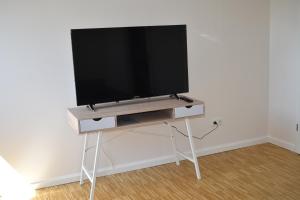TV i/ili multimedijalni sistem u objektu TOP Ferien Apartment Bohmte