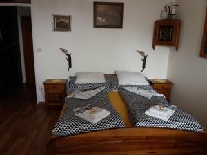 a bed with two plates and candles on it at Apartma mit Seeblick in Sankt Gilgen