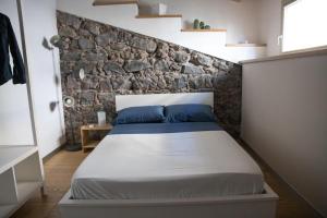 A bed or beds in a room at Ghè House