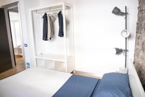 A bed or beds in a room at Ghè House