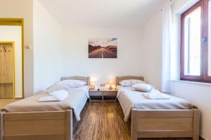 Posteľ alebo postele v izbe v ubytovaní Kelava Rooms