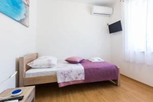 Posteľ alebo postele v izbe v ubytovaní Kelava Rooms